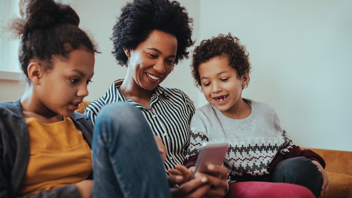 mother with children looking at phone