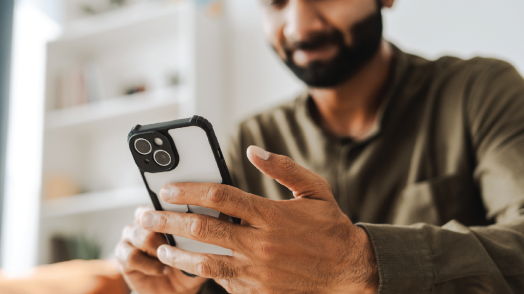 close up of man's hand holding phone