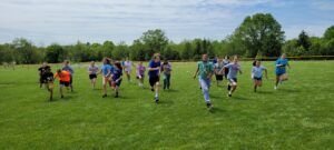 students running across a field