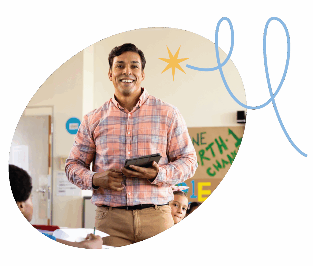 elementary teacher holding tablet in classroom with students