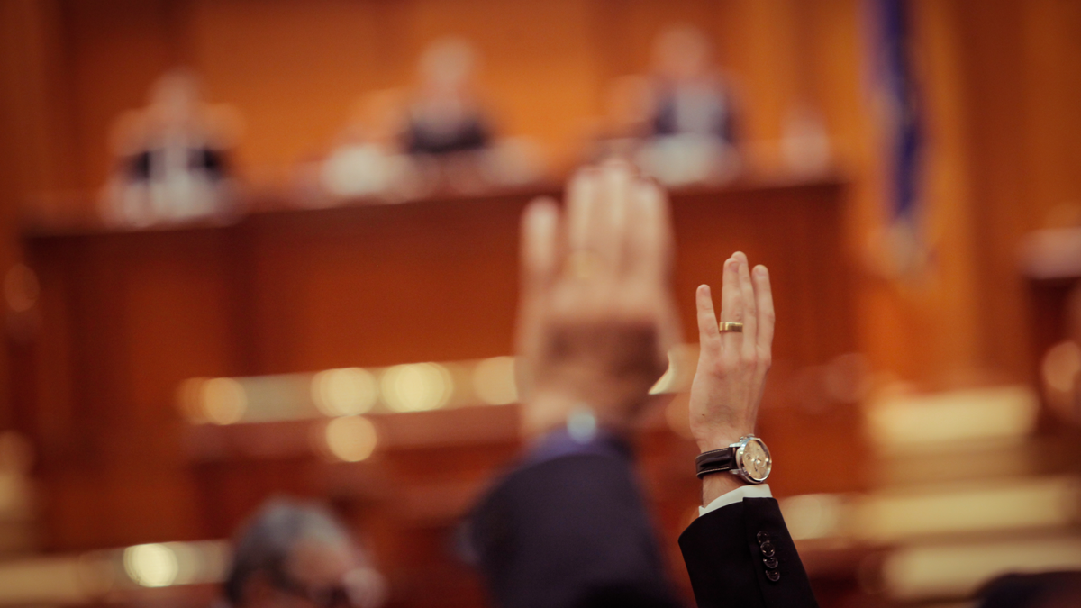 hands raised in courtroom