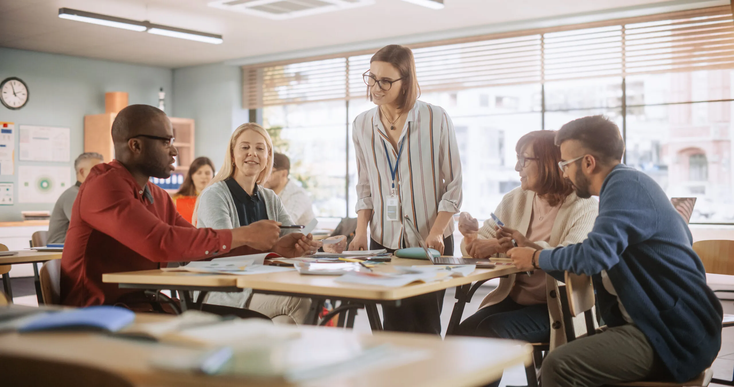 team of school professional meeting at table