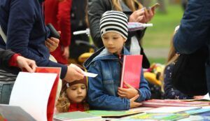 children choosing and buying books at the book fair