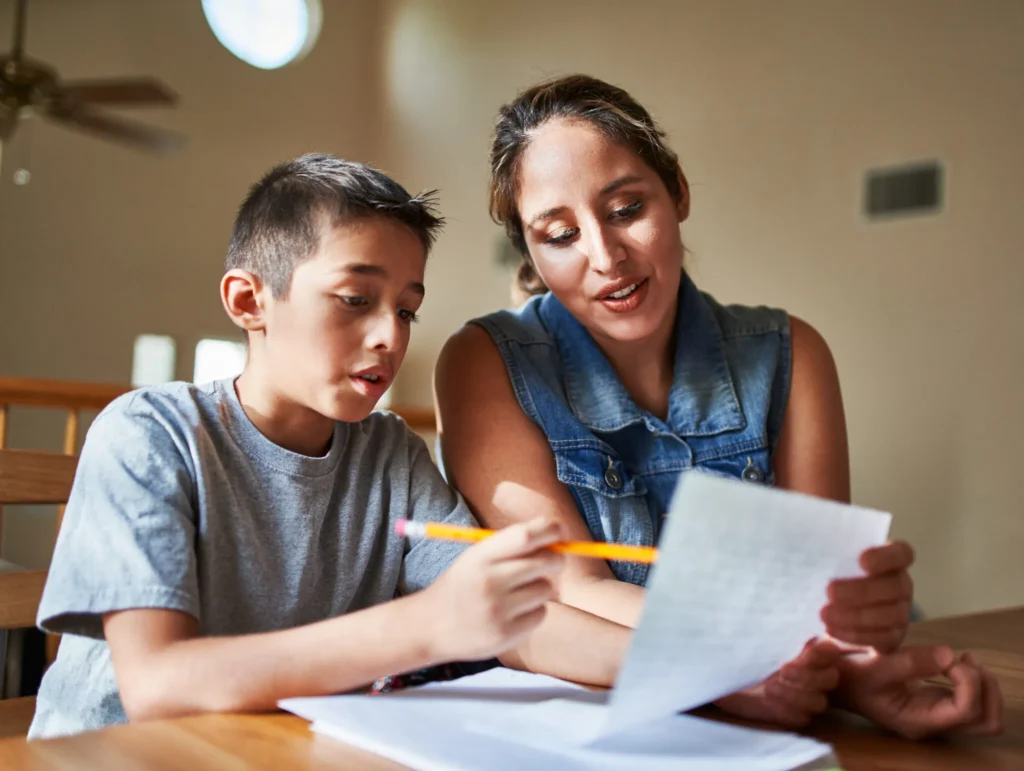 mother helping son with homework