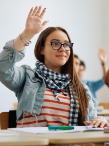 female high school student raising hand