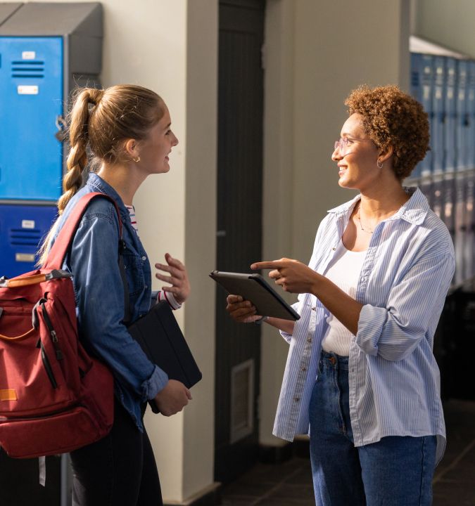 A teacher talking to a student