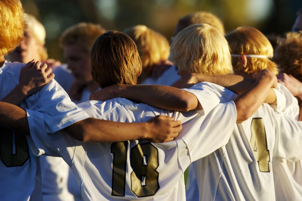 High school soccer team huddle
